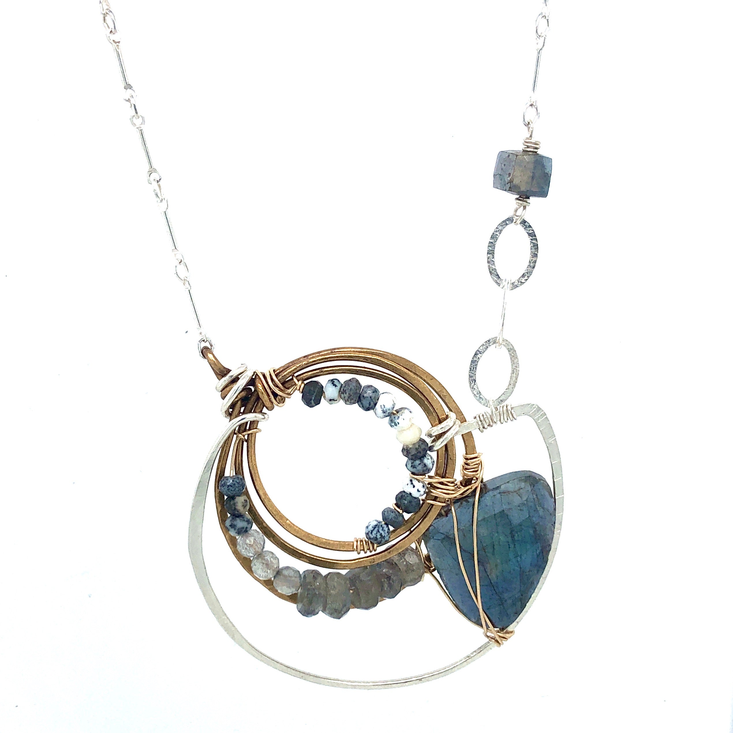 brass triple knot attached to hammered sterling silver pendant with flashy labradorite fan, dendritic opal, and labradorite faceted gemstones on sterling silver bar chain