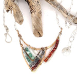 Amazonite, blue labradorite, crystal, and cubic zirconia gemstones all wrapped up within a bronze, sterling silver, and brass twist mountain scape pendant on sterling silver chain