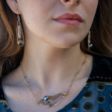 Sterling silver skinny drop earrings with fresh water stick pearls wrapped in brass wire and a crystal disco ball nested in gold filled wire