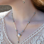 Handmade brass necklace with twisted bars intersperse with silver blue fresh water pearls and a sterling silver chain