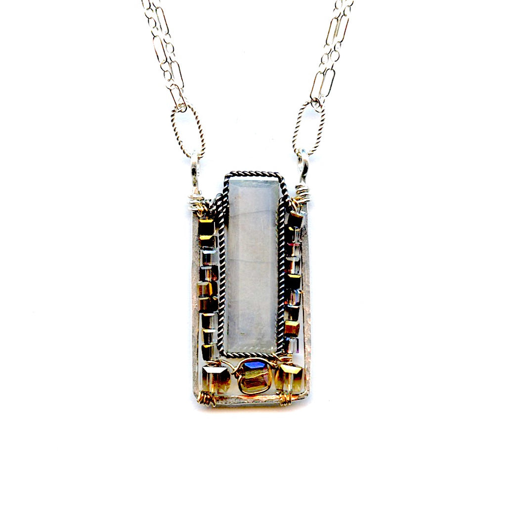 smooth rectangular moonstone wrapped in oxidized sterling silver twisted wire and pink gold crystal cubes within a sterling silver box pendant on a doubled up sterling silver delicate chain