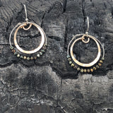 Hammered bronze ring earrings with a double ring of pyrite gemstones on sterling silver wire