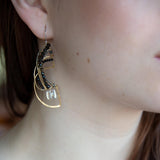 Brass hammered earrings line with dark olive cat's eye, black spinel, and quartz cube gemstones