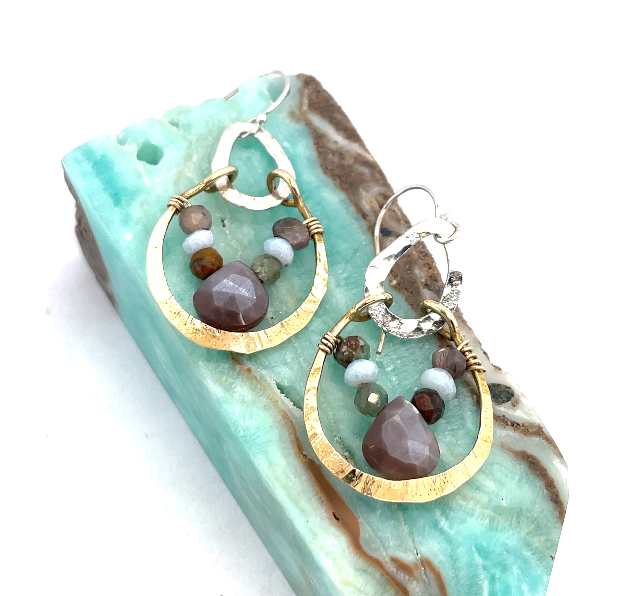 mauve moonstone and opal faceted gemstones held within a brass hammered ring hanging onto a sterling silver teardrop link mini earrings