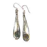 Oxidized sterling silver long drop earrings with labradorite and pyrite gemstones held within brass and sterling silver wire